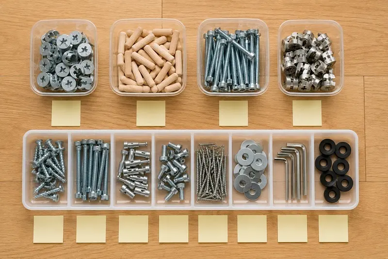 Screws and bolts sorted into small containers